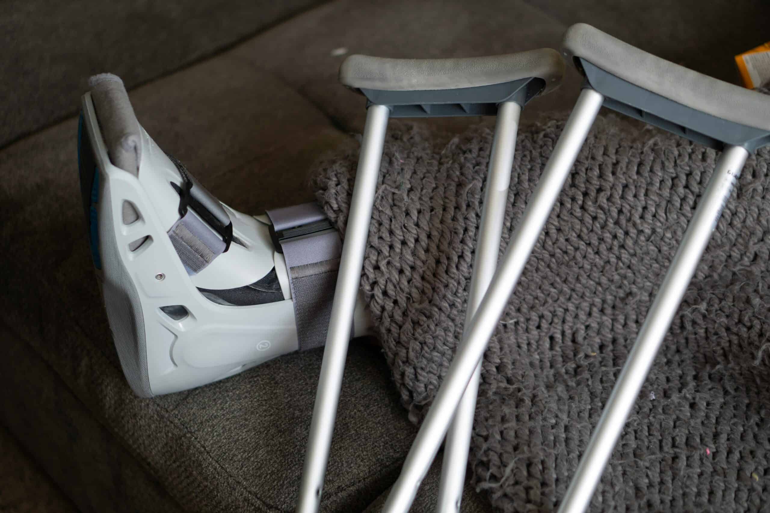 pexels-ollyking-4067795 foot brace and crutches post-surgery